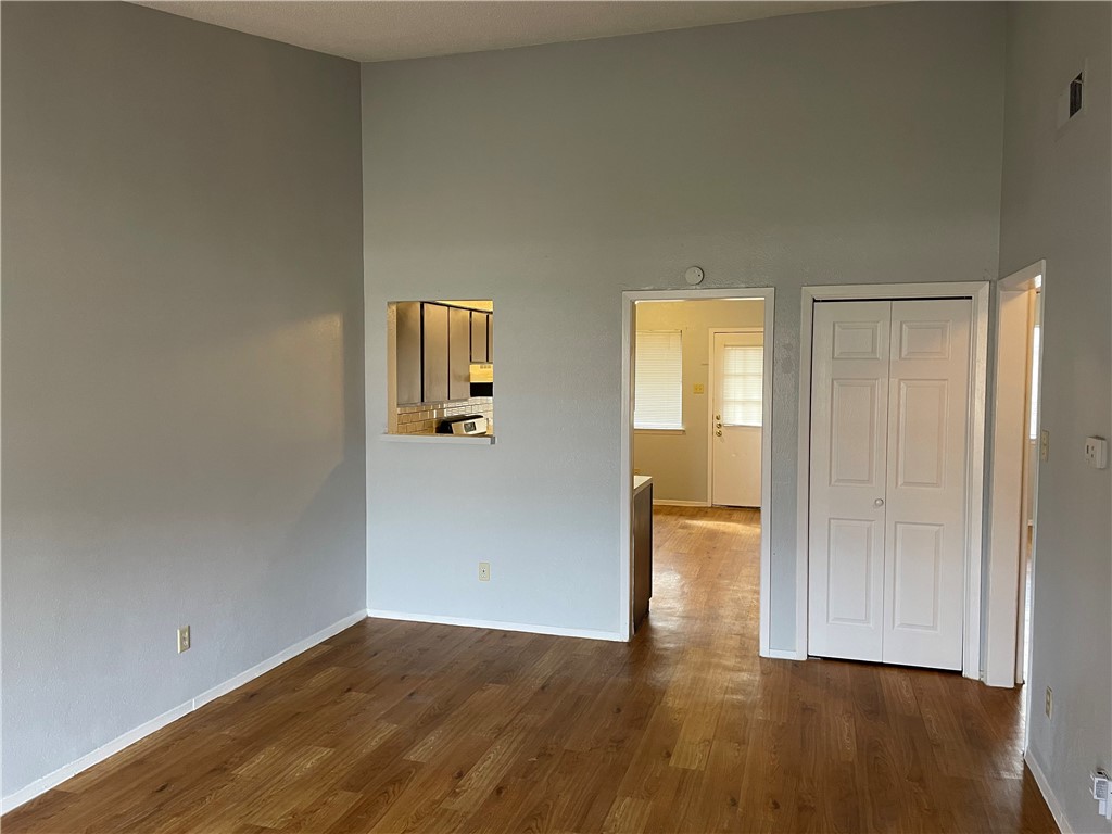 105 Meteor Drive, Unit A Austin, TX 78745 - Photo 2 of 23 wooden floor in an empty room