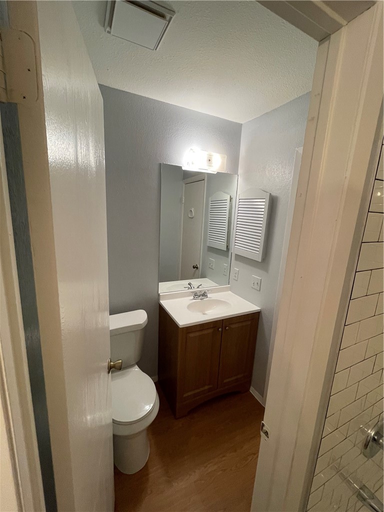 105 Meteor Drive, Unit A Austin, TX 78745 - Photo 21 of 23 a bathroom with a sink and mirror with toilet
