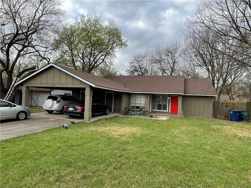 105 Meteor Drive, Unit A Austin, TX 78745 - Photo 23 of 23 a view of a house with a yard and large trees