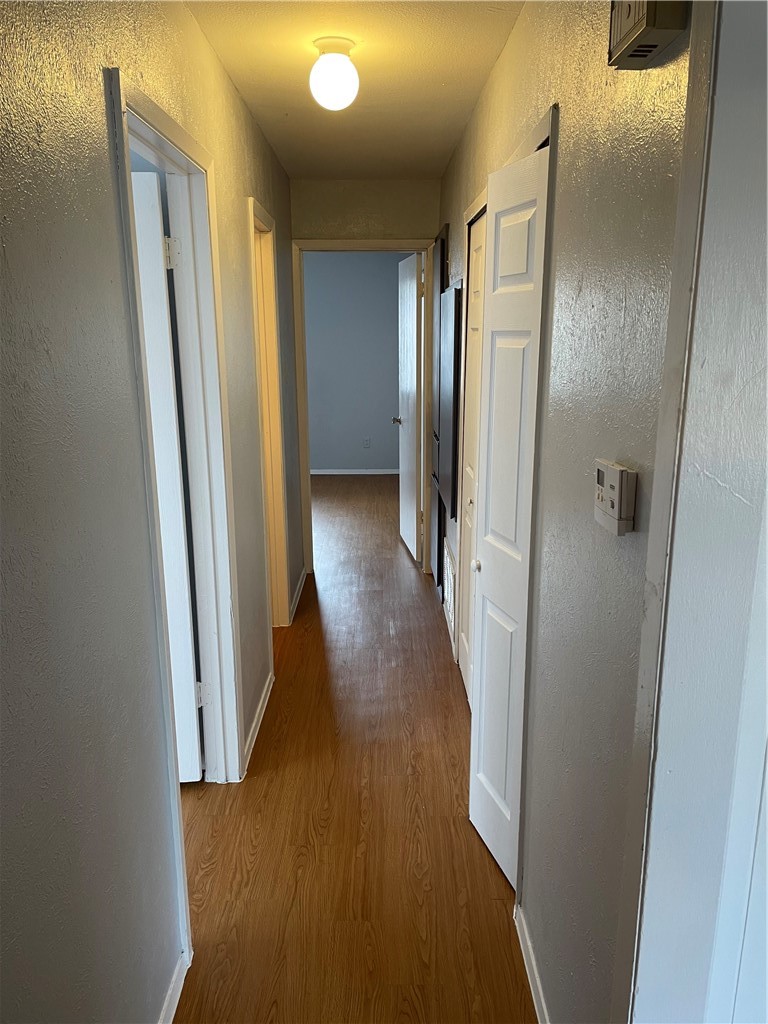 105 Meteor Drive, Unit A Austin, TX 78745 - Photo 10 of 23 a view of a hallway with wooden floor