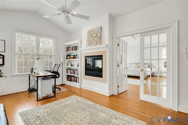 a living room with furniture a fireplace and a table