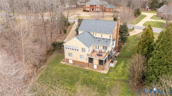 a aerial view of a house with a yard