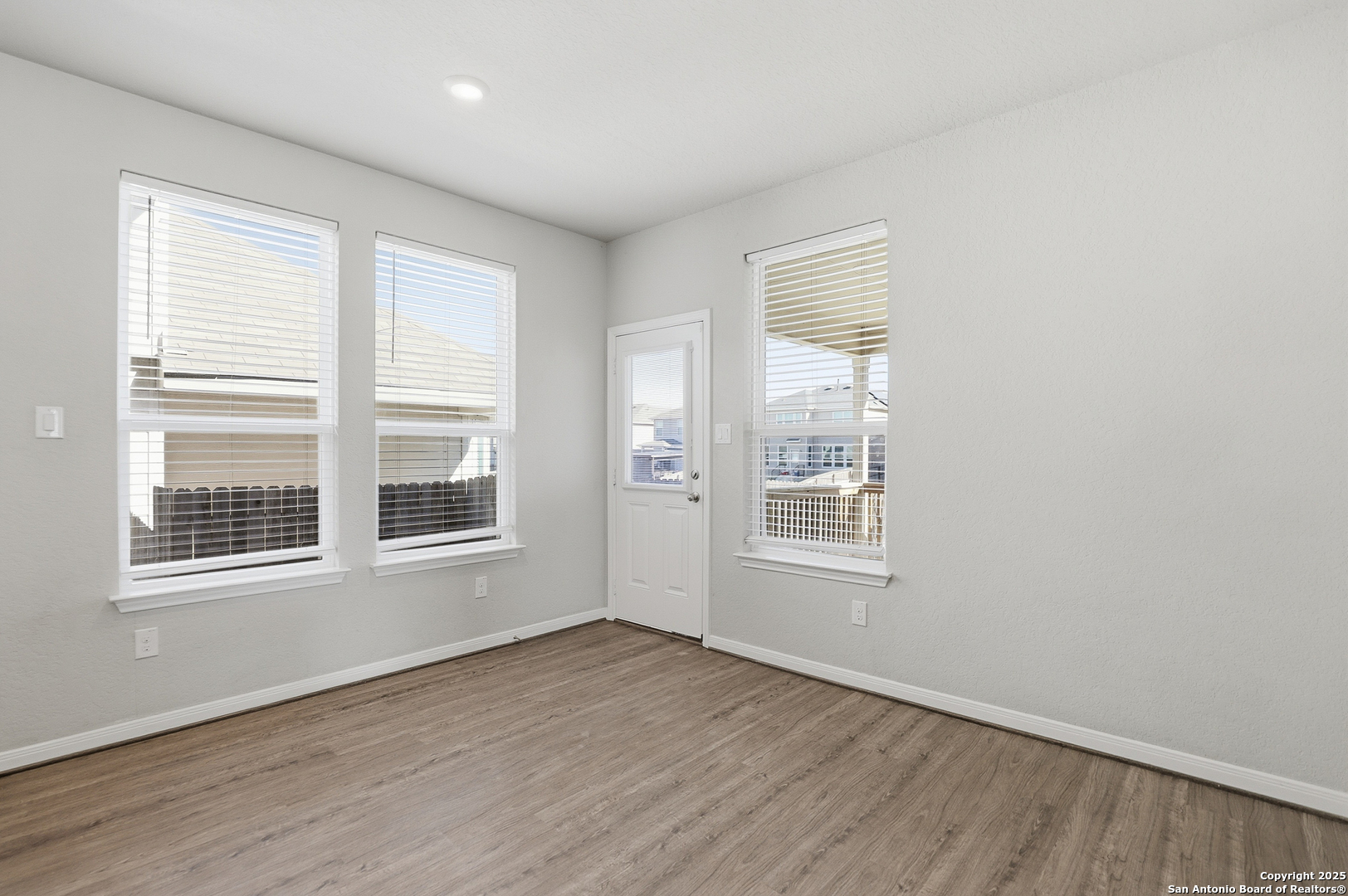 5002 Longhorn Converse, TX 78109 - Photo 14 of 36 an empty room with wooden floor and windows