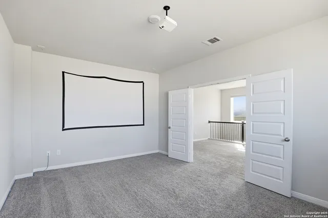 a view of an empty room with closet