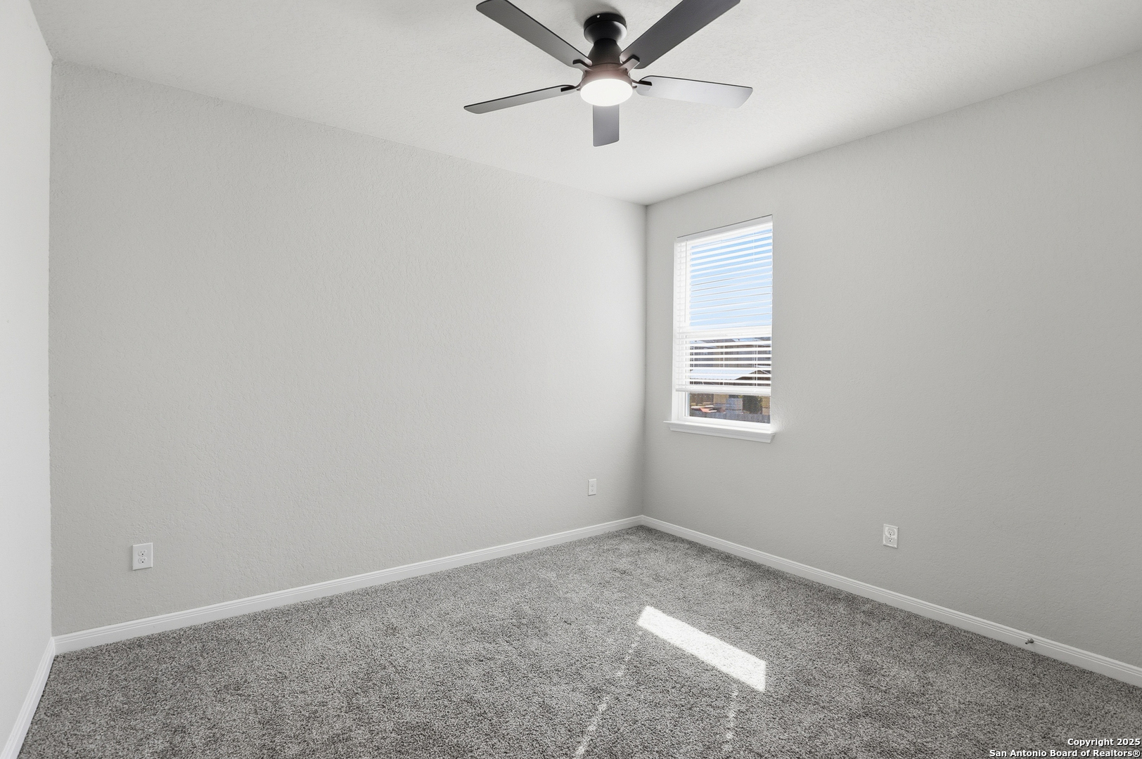 5002 Longhorn Converse, TX 78109 - Photo 29 of 36 an empty room with a window and a fan