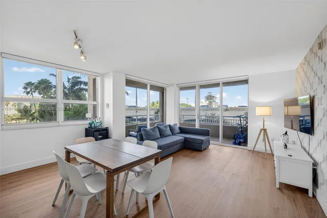 a kitchen with a refrigerator and a sink