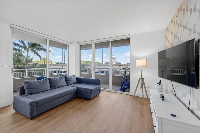a kitchen with stainless steel appliances a refrigerator sink and cabinets