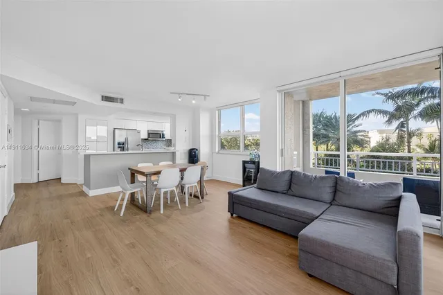a kitchen with a stove a sink and a microwave