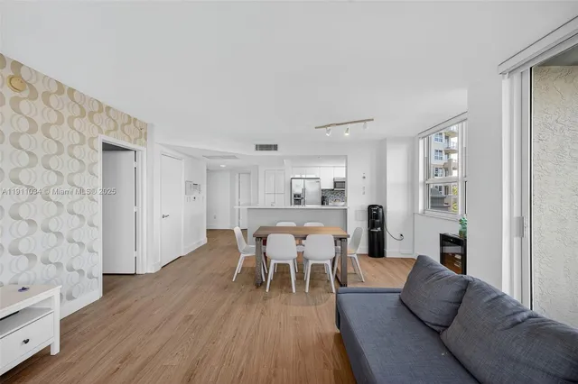 a kitchen with stainless steel appliances a sink and a stove