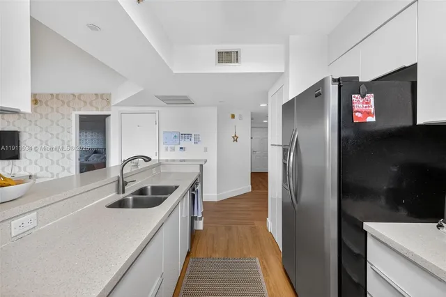 a living room with baby bed furniture and a window