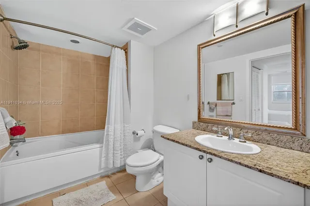 a view of building with yard and swimming pool