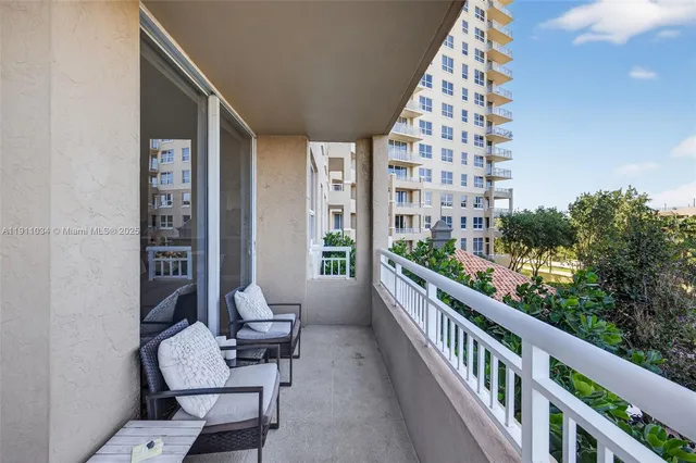 a view of a patio with couches chairs dining table and chairs