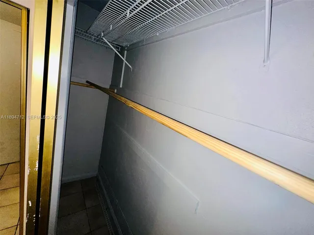 a view of hallway with cabinets