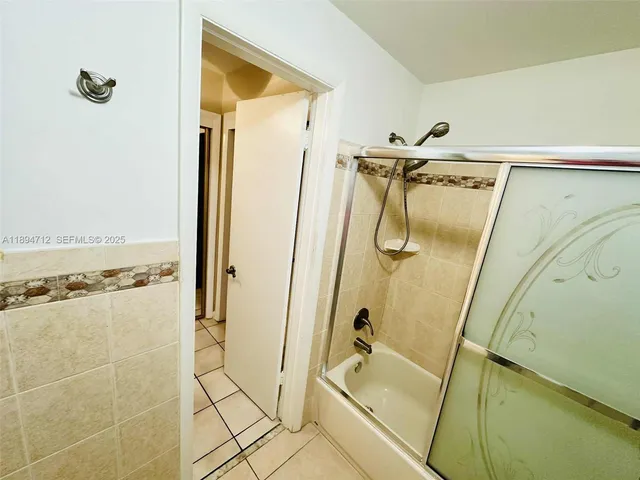 a view of swimming pool with outdoor seating and plants