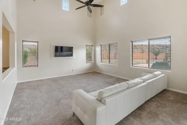 a living room with furniture and windows
