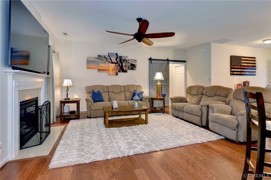 8343 Patrick Henry Way Gloucester, VA 23061 - Photo 16 of 39 a living room with furniture and a fireplace