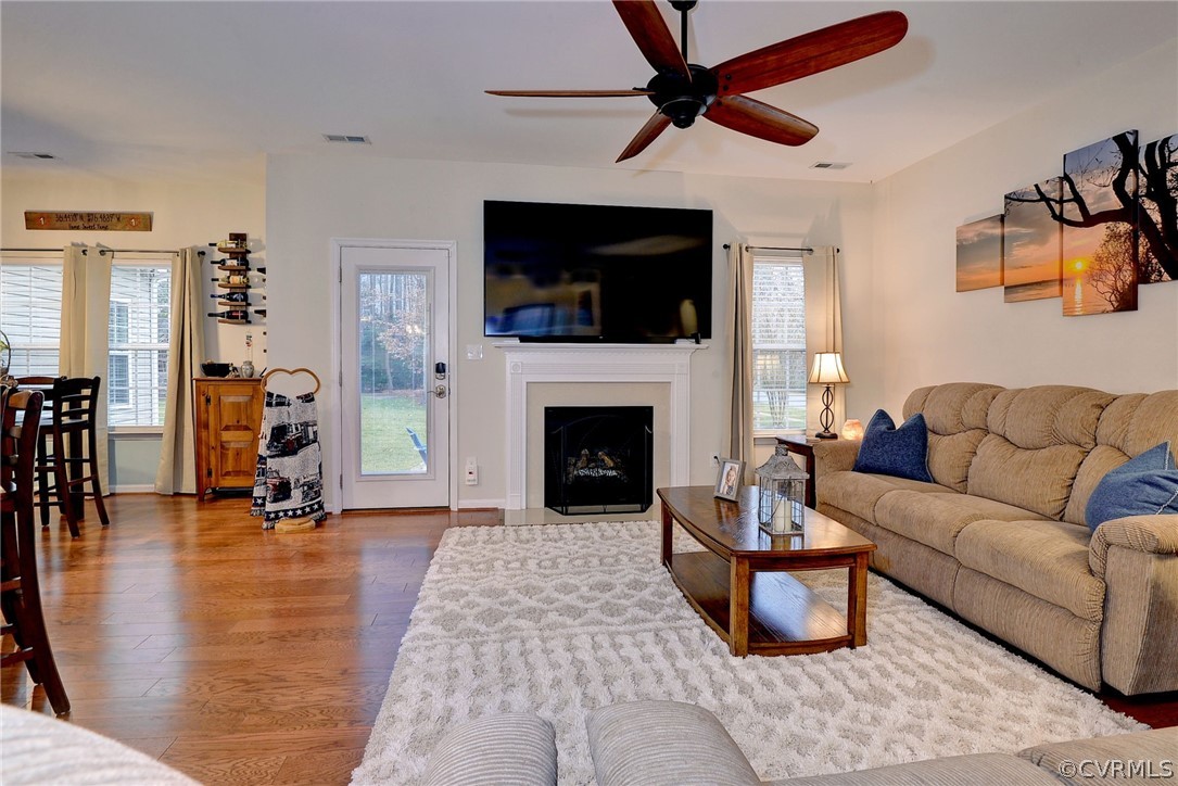 8343 Patrick Henry Way Gloucester, VA 23061 - Photo 17 of 39 a living room with furniture and a fireplace