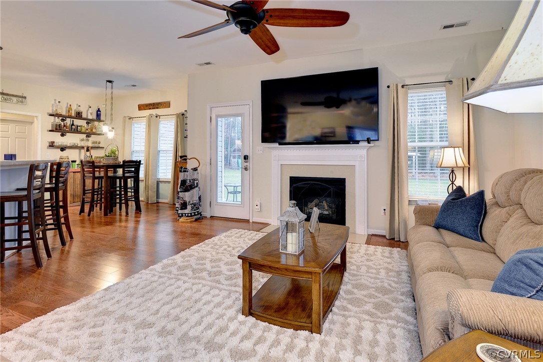 8343 Patrick Henry Way Gloucester, VA 23061 - Photo 18 of 39 a living room with furniture and a flat screen tv