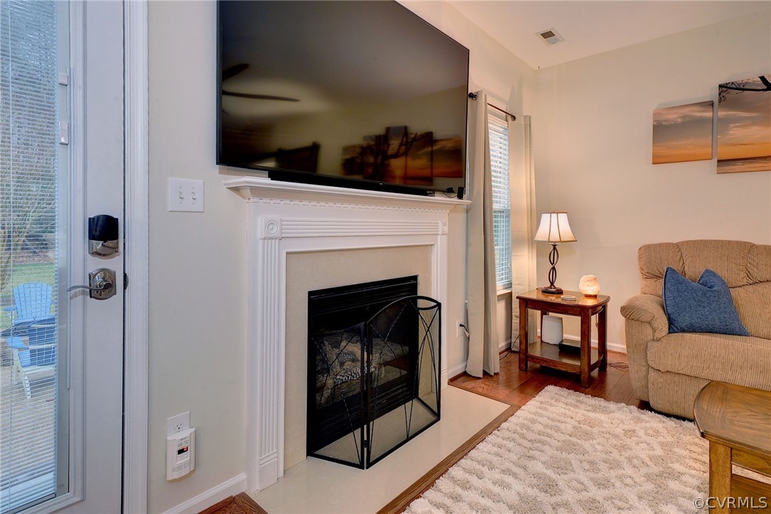 8343 Patrick Henry Way Gloucester, VA 23061 - Photo 19 of 39 a living room with furniture and a fireplace