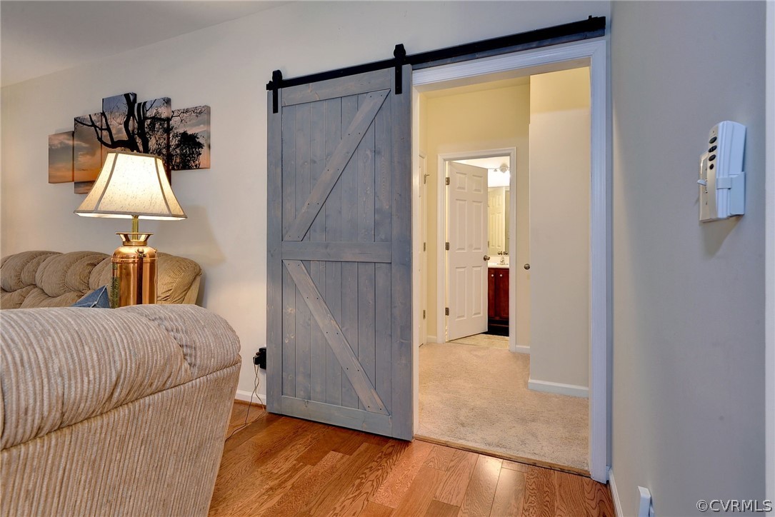 8343 Patrick Henry Way Gloucester, VA 23061 - Photo 20 of 39 a bedroom with a bed and a mirror