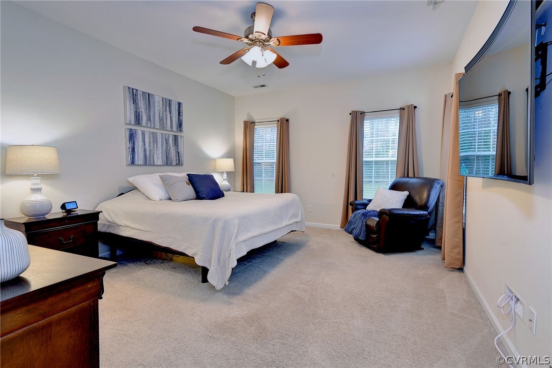 8343 Patrick Henry Way Gloucester, VA 23061 - Photo 21 of 39 a bedroom with a bed and wooden floor