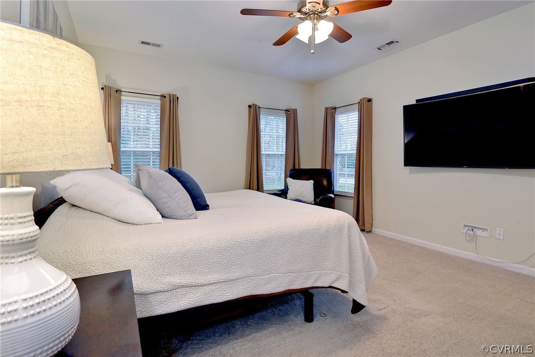 8343 Patrick Henry Way Gloucester, VA 23061 - Photo 22 of 39 a bedroom with a bed and a flat screen tv