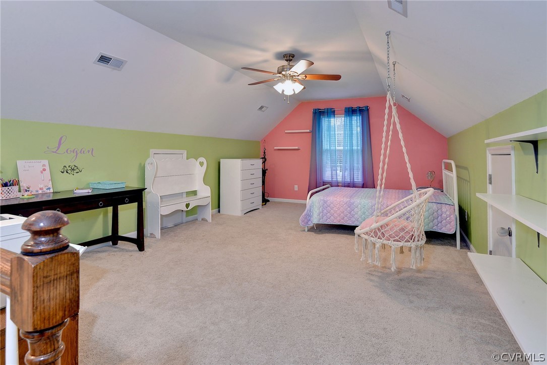 8343 Patrick Henry Way Gloucester, VA 23061 - Photo 27 of 39 a bedroom with furniture and a chandelier