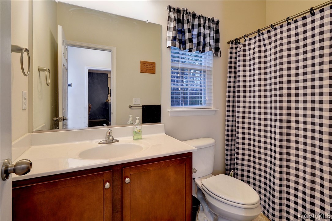 8343 Patrick Henry Way Gloucester, VA 23061 - Photo 29 of 39 a bathroom with a sink a toilet and shower