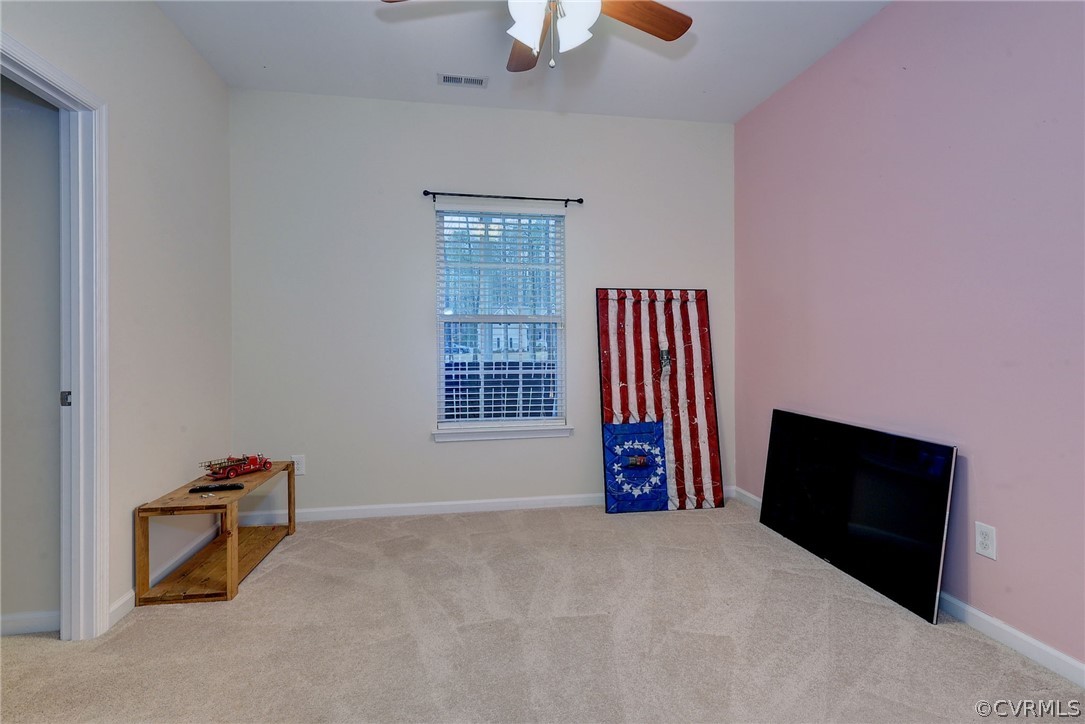 8343 Patrick Henry Way Gloucester, VA 23061 - Photo 30 of 39 a view of an empty room with furniture and a window