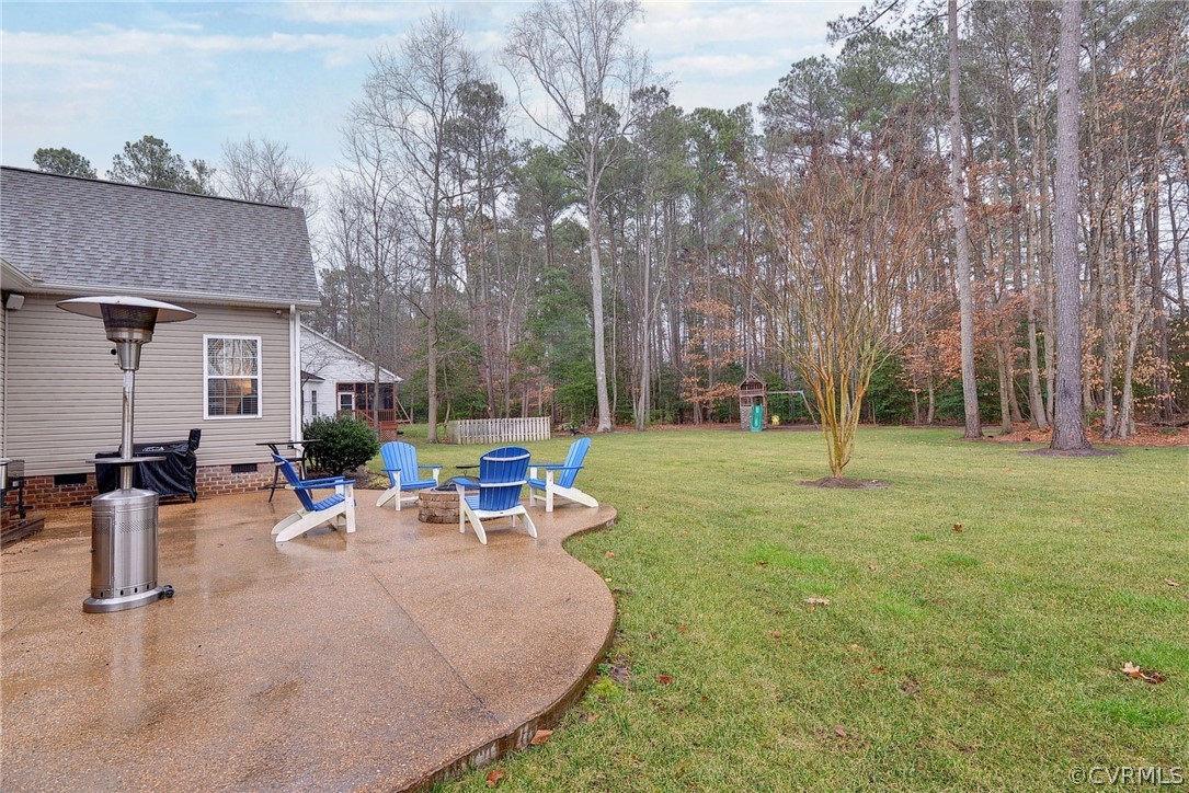 8343 Patrick Henry Way Gloucester, VA 23061 - Photo 32 of 39 a view of a backyard with sitting area