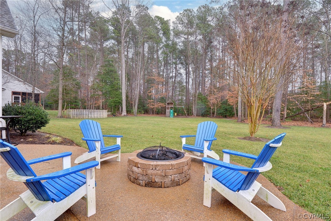 8343 Patrick Henry Way Gloucester, VA 23061 - Photo 33 of 39 a view of a backyard with sitting area and slide