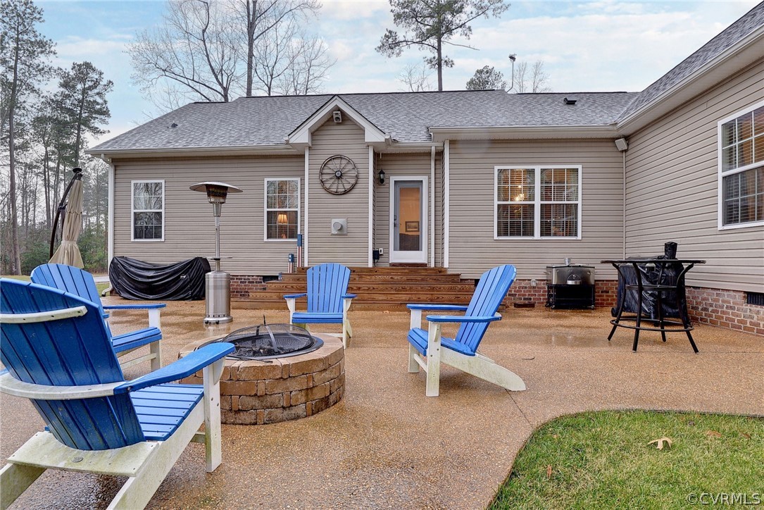 8343 Patrick Henry Way Gloucester, VA 23061 - Photo 34 of 39 a view of a patio with table and chairs