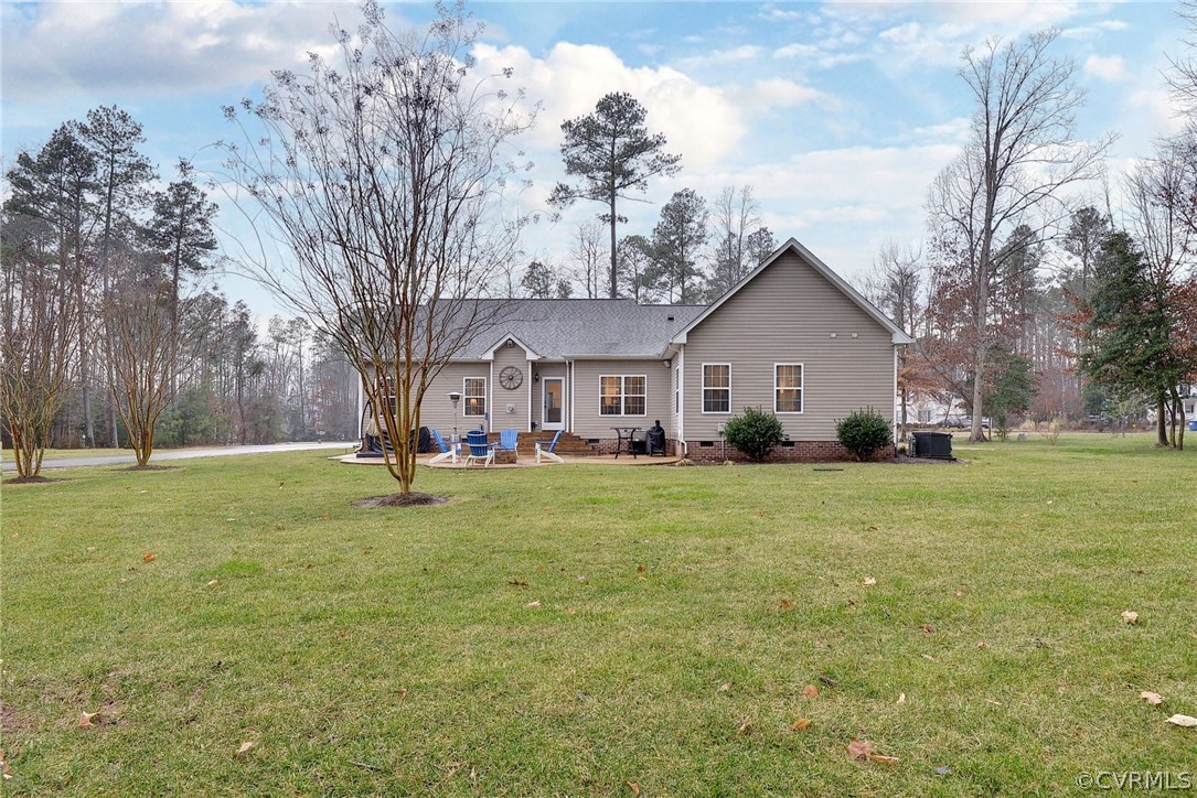 8343 Patrick Henry Way Gloucester, VA 23061 - Photo 38 of 39 a view of a yard with a house and garden