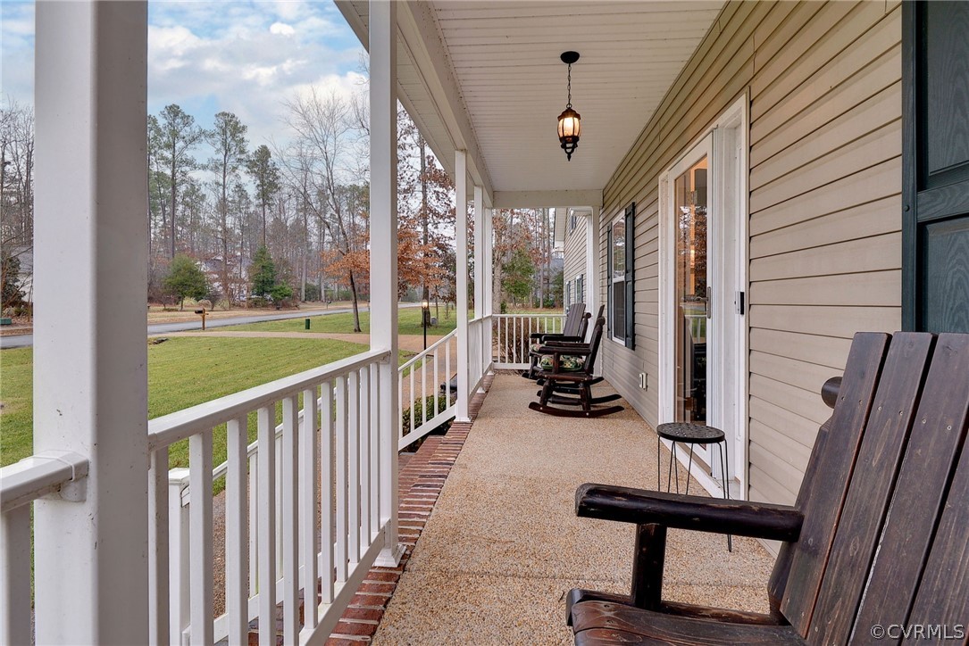 8343 Patrick Henry Way Gloucester, VA 23061 - Photo 4 of 39 a view of a porch with furniture and floor to ceiling window