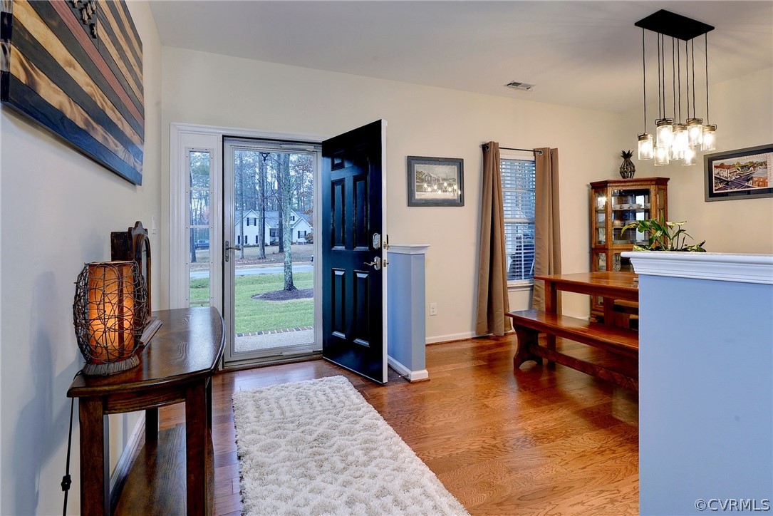 8343 Patrick Henry Way Gloucester, VA 23061 - Photo 5 of 39 a view of hall way with furniture and chandelier