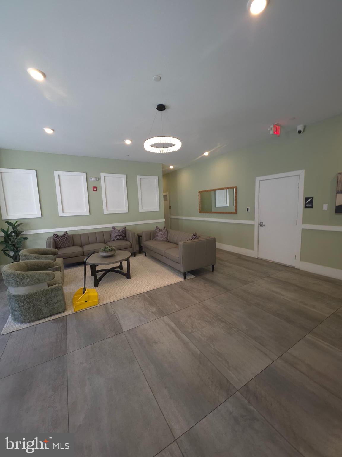 3503 Midvale Avenue, Unit 506 Philadelphia, PA 19129 - Photo 3 of 40 a living room with furniture and kitchen view