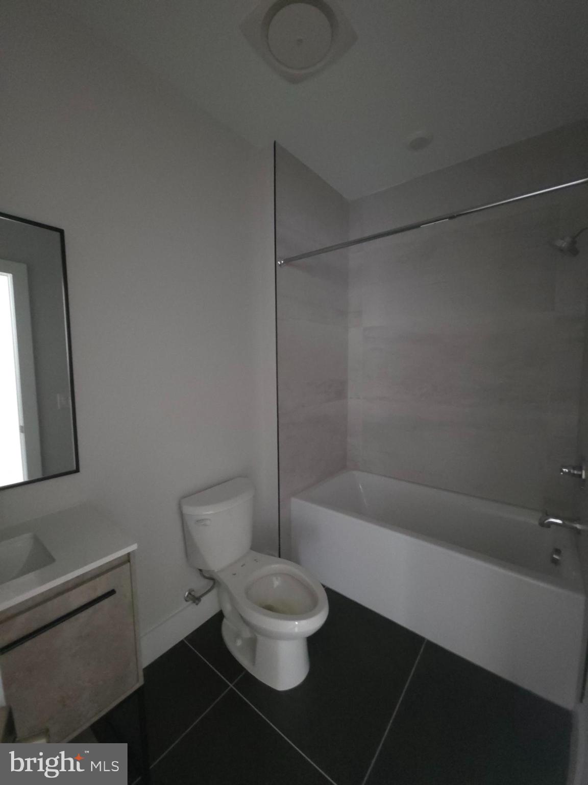 3503 Midvale Avenue, Unit 506 Philadelphia, PA 19129 - Photo 32 of 40 a bathroom with a toilet and a shower