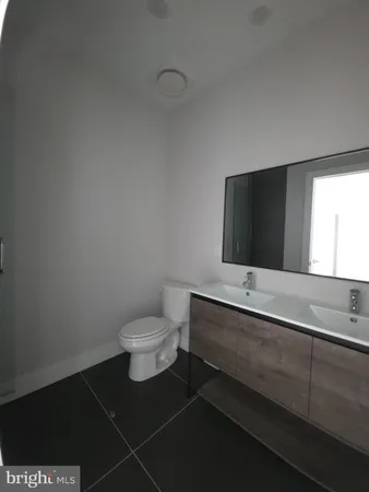a view of an empty room and wooden floor