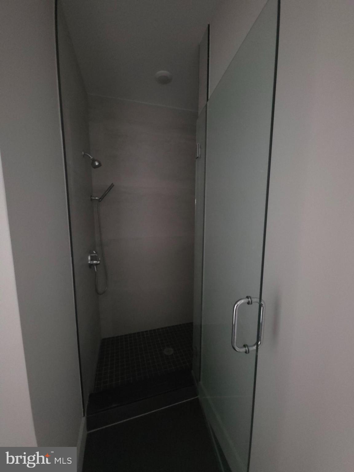 3503 Midvale Avenue, Unit 506 Philadelphia, PA 19129 - Photo 37 of 40 a bathroom with a glass door shower