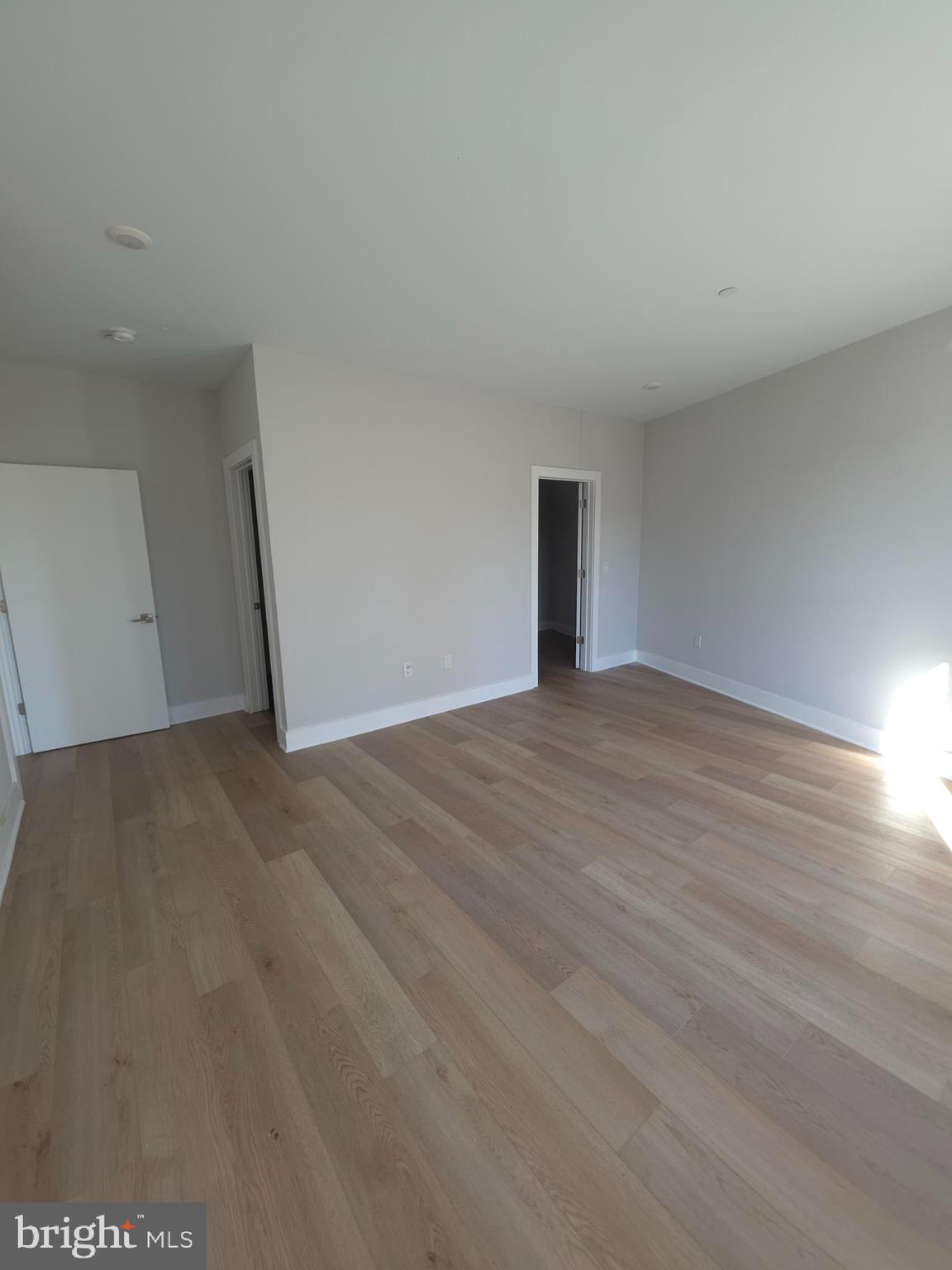 3503 Midvale Avenue, Unit 506 Philadelphia, PA 19129 - Photo 38 of 40 a view of an empty room and wooden floor