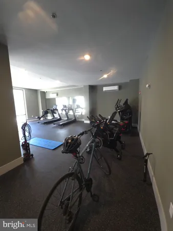 a view of hallway with livingroom and furniture