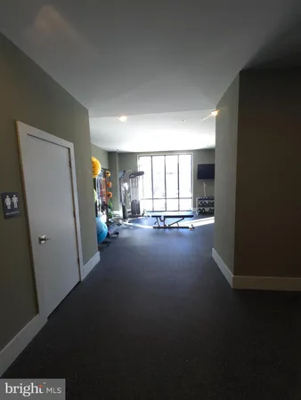 a room with lots of chairs and view of living room