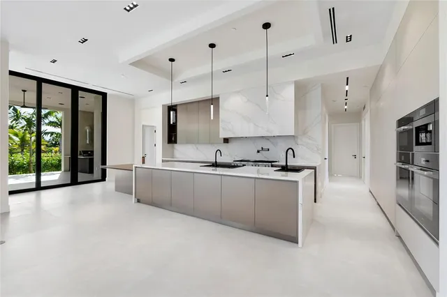 a kitchen with a table chairs and a refrigerator