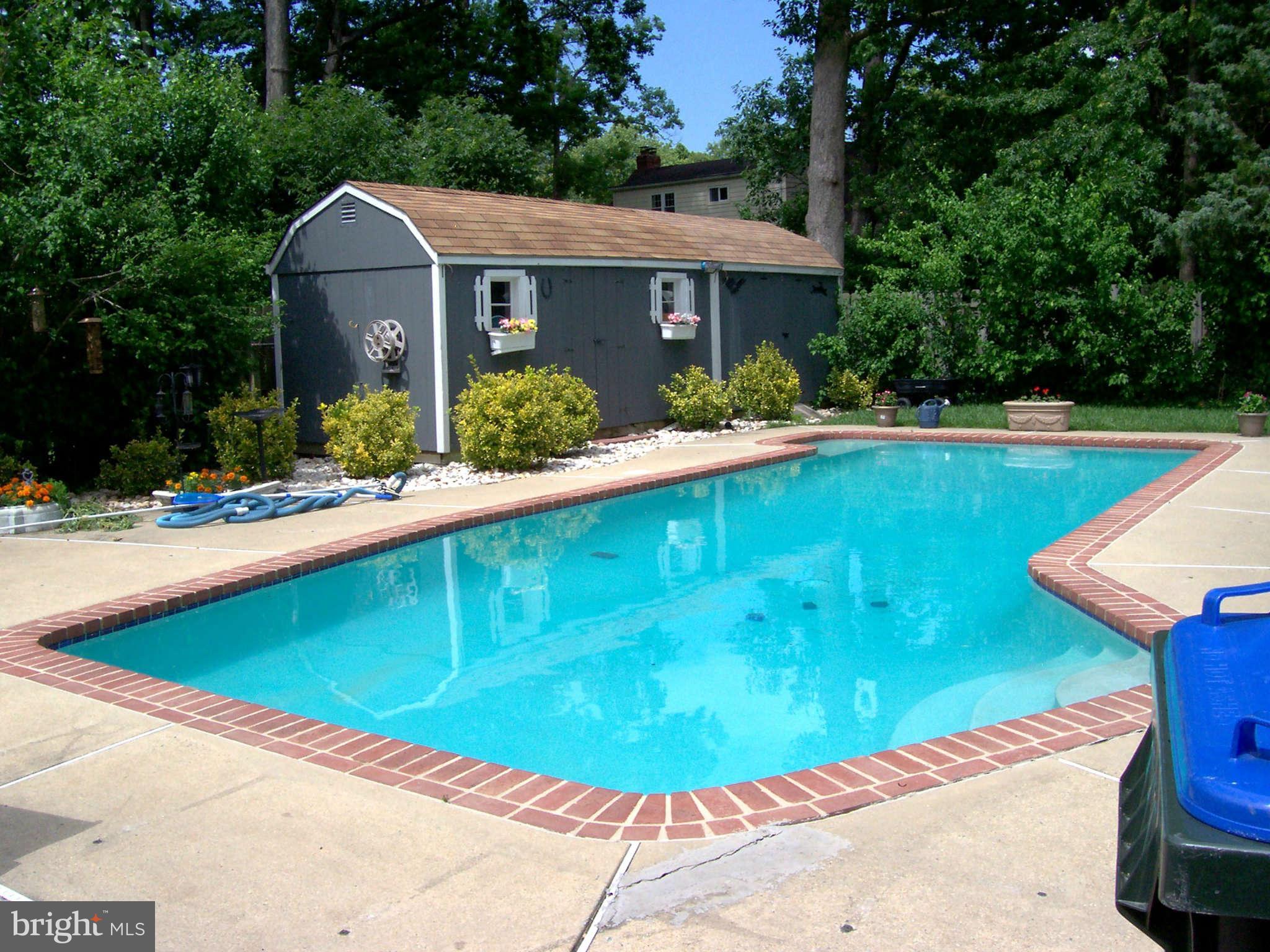 5527 Rolling Road Springfield, VA 22151 - Photo 9 of 27 a view of a house with pool