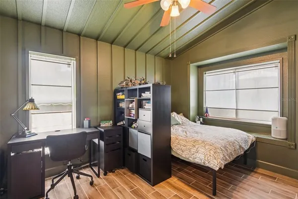 a bedroom with furniture and a window
