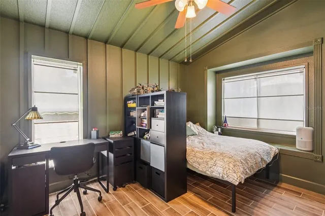 a bedroom with furniture and a window