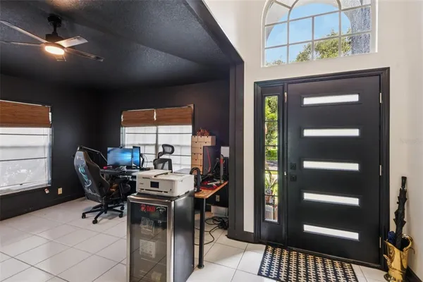a work room with furniture and a window