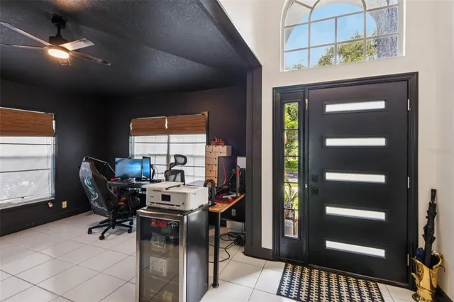 a work room with furniture and a window
