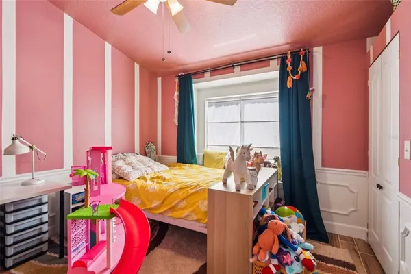 a bedroom with furniture and a bed