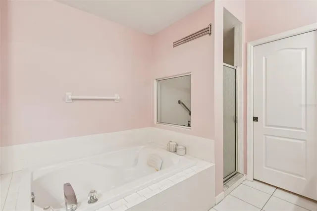 a bathroom with a bathtub and a sink